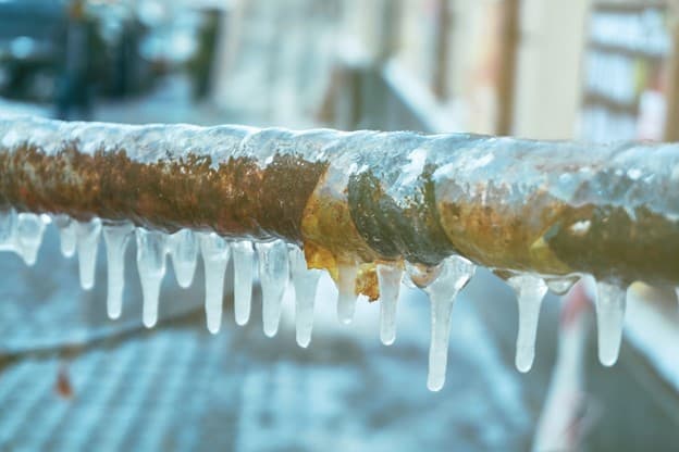 Frozen pipe in an unheated Toronto garage in winter